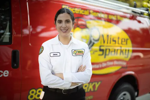 Mister Sparky Electrician Tech Jane in front of her van