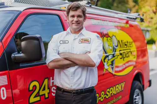 Mister Sparky Electrician Pete in front of his van