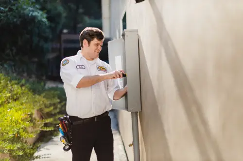 Mister Sparky Electrician working on whole home circuit